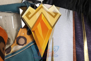 Genshin Impact Xilonen cosplay waist chain detail centers a gold emblem against dark turquoise and purple textured fabric.