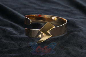 Genshin Impact Xilonen cosplay ring centers a raised lightning bolt motif on a gold-tone open metal cuff bracelet.