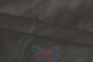 Genshin Impact Xilonen cosplay arm cuff material traces the smooth folded surface of black faux leather fabric.