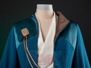 The Acolyte Mon Mothma cosplay coat pairs a blue turquoise-yoke piece and lapel brooch over a cream v-neck tunic.