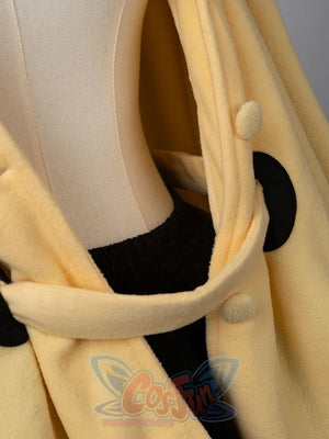 Interior lining detail of yellow spark cute cape dress showing quality construction and buttons