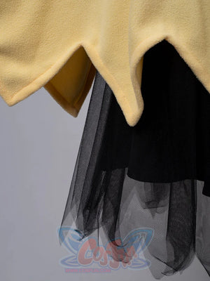 Jagged hem detail of yellow spark cute cape dress showing black tulle skirt underneath