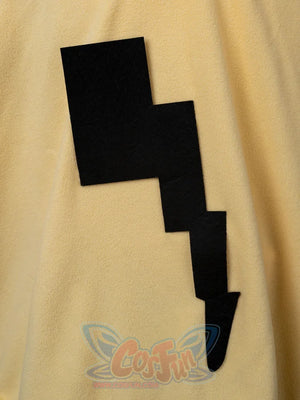 Close-up of black lightning bolt applique detail on yellow spark cute cape dress