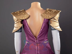 Twilight Princess Zelda cosplay pauldrons anchor teal-gem scrollwork above decorated white sleeves and purple top.