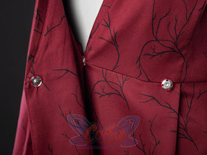 Rhaenyra Targaryen cosplay dress detail centers a snap-button seam over maroon branch-patterned fabric with an inner white.