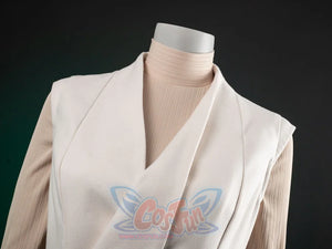 The Acolyte Mon Mothma cosplay layers a beige ribbed turtleneck shirt beneath an off-white sleeveless wrap-front vest.