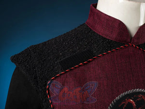 Jacaerys Velaryon cosplay jacket traces red dragon embroidery beneath twisted trim on textured black sleeveless coat.