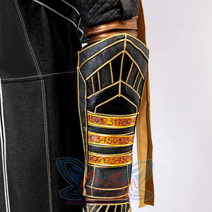 Clair Obscur: Expedition 33 Gustave cosplay bracer traces gold piping across three yellow-gold script-detailed panels.