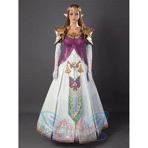Twilight Princess Zelda cosplay gown anchors ornate crown above gold pauldrons and detailed purple-and-white skirt.