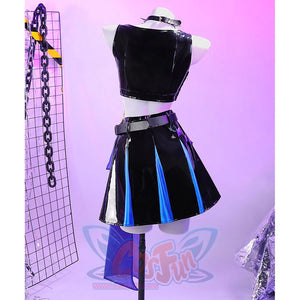 Back view of the Guinevere punk costume showing the shiny black crop top and the black-blue-purple patched mini skirt.