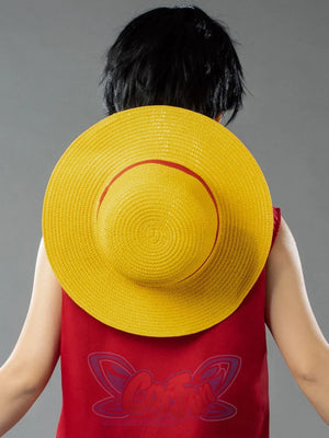 Japanese Anime Monkey D. Luffy cosplay straw hat sets a red ribbon band against yellow woven papyrus.