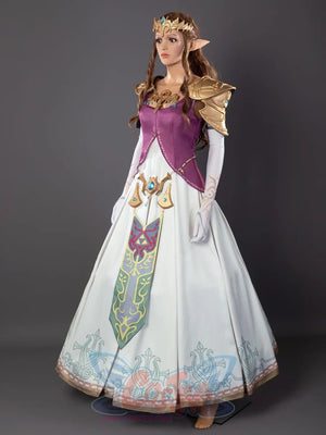 Twilight Princess Zelda cosplay dress layers gold-trimmed purple bodice above patterned white skirt and front banner.