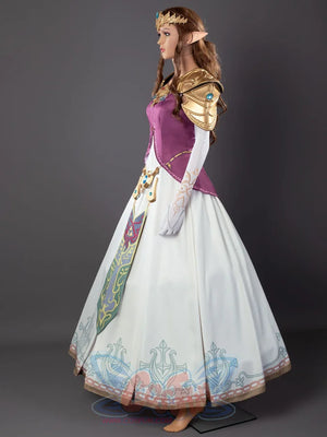 Twilight Princess Zelda cosplay dress drops blue-gem-trimmed white skirt beneath purple gold-edged bodice and sash.