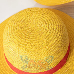 Japanese Anime Monkey D. Luffy cosplay straw hat centers a red ribbon band across the woven yellow crown.