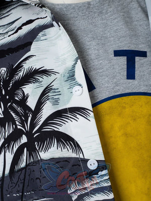Venom: The Last Dance Eddie Brock cosplay set pairs grey tee with blue letter and yellow circle alongside palm shirt.