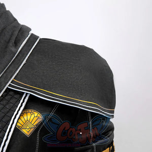 Clair Obscur: Expedition 33 Gustave cosplay shoulder piece centers fan-shaped gold patch on white-trimmed torso.