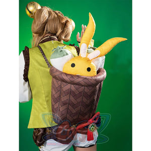 Genshin Impact Yaoyao cosplay vest frames patterned green fabric over braided strap beside brown basket backpack.