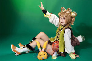Genshin Impact Yaoyao cosplay full set gathers multi-layered top and shorts beside patterned bag and hair accessories.