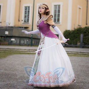 Twilight Princess Zelda cosplay dress balances gold armor pauldrons above patterned white skirt and purple bodice.