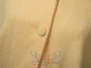 Close-up of button closure detail on yellow spark cute cape dress showing quality craftsmanship