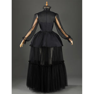 Addams black evening dress back view showing mesh sleeves and tiered skirt details