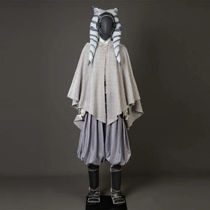 Shows a mannequin in Ahsoka Tano’s cosplay, featuring a gray hooded cloak, patterned pants, and a headpiece with montrals.
