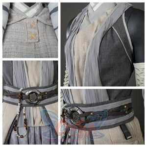 Presents close-ups of Ahsoka Tano’s layered gray vest, beige inner top, and decorative belt with beads and a metal buckle.