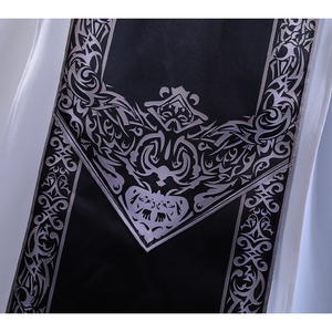 Detail view of back, a black piece is shown, decorated with delicate patterns.