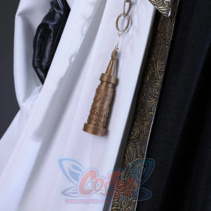 There is a belt with a metal chain and decorations at the waist and bells, an ornament is hung on the chain.