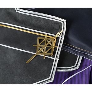 A gold metallic brooch adorns the overcoat, echoing the overall design.