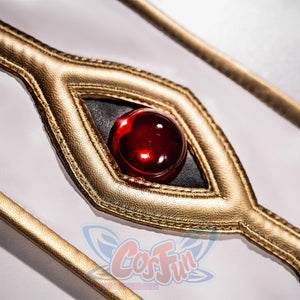 Anime Lelouch cosplay eye emblem centers a red orb within a gold-framed eye design over white fabric.