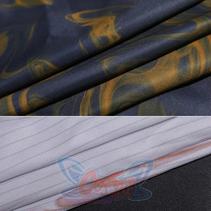 Fabric detail of Clea Dessendre cosplay costume showing blue material with golden bird patterns and white striped textile