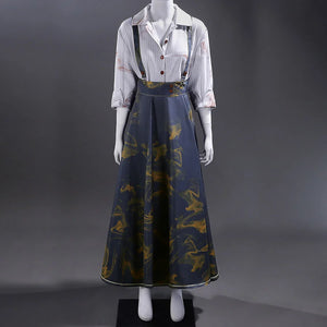 Full view of Clea Dessendre cosplay costume featuring a white striped shirt with button details and a blue suspender skirt adorned with golden bird patterns