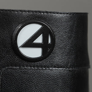 Sue Storm cosplay shoes detail close-up of Fantastic Four logo medallion with textured boot surface