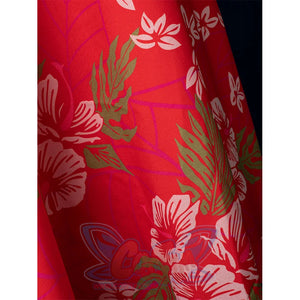 Aerith cosplay red apron printed extreme closeup with pink floral design, costume detail