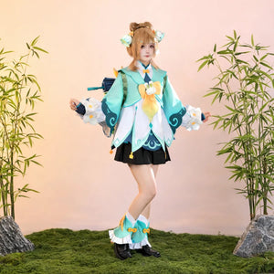 Yaoyao cosplay costume full set with teal coat, white floral decorations, and black shorts, modeled with bamboo background