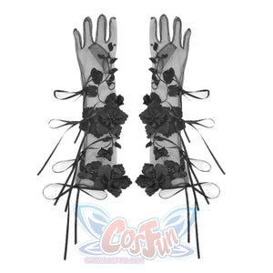 Long black sheer gloves on white background, decorated with 3D floral appliques and ribbon bow details along the length.