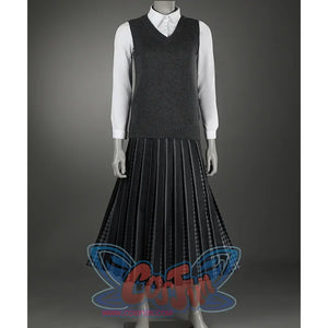 A knitted vest and a collared shirt give the overall style a formal feel, paired with a black pleated long skirt.