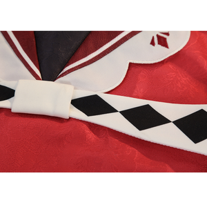 Sparkle cosplay waist detail with white bow accent, checkered belt, and red cape fabric