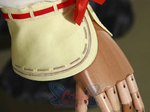 Genshin Impact Yaoyao cosplay glove cuff layers pale yellow fabric beside gold trim and red tie detail.