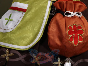 Genshin Impact Yaoyao cosplay apron pairs embroidered pocket and orange drawstring bag beside three glittery star charms.