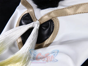 Genshin Impact Yaoyao cosplay skirt detail centers gold-trimmed black heart applique beside white and yellow ombre tassel.