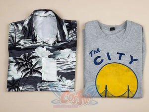 Venom: The Last Dance Eddie Brock cosplay set neatly folds grey City tee alongside black and white palm shirt.