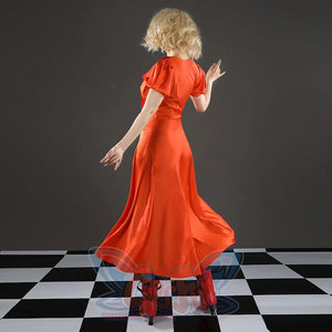 Ida cosplay costume back view showing orange satin dress and red heeled boots on checkered floor