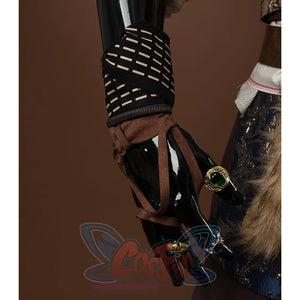 There are uniquely designed gloves on the wrists, with black and beige stripes interwoven with brown straps, and several rings on the hands.