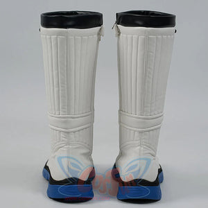 White knee-high boots with black tops and blue soles on a gray background