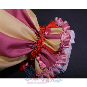 Kid Pennywise costume wrist cuff detail with pink ruffles and decorative red tassels