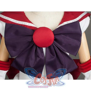 Close - up of the large purple bow with a red round center on the front of the costume, showcasing decorative details.