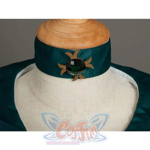 Close - up of the dark green neckline collar with a decorative gem and gold - like accents, highlighting the neckline design.
