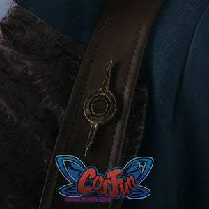 Close-up of a bronze-colored emblem on the brown leather strap of the Lies of P cosplay costume, set against patterned black fabric.